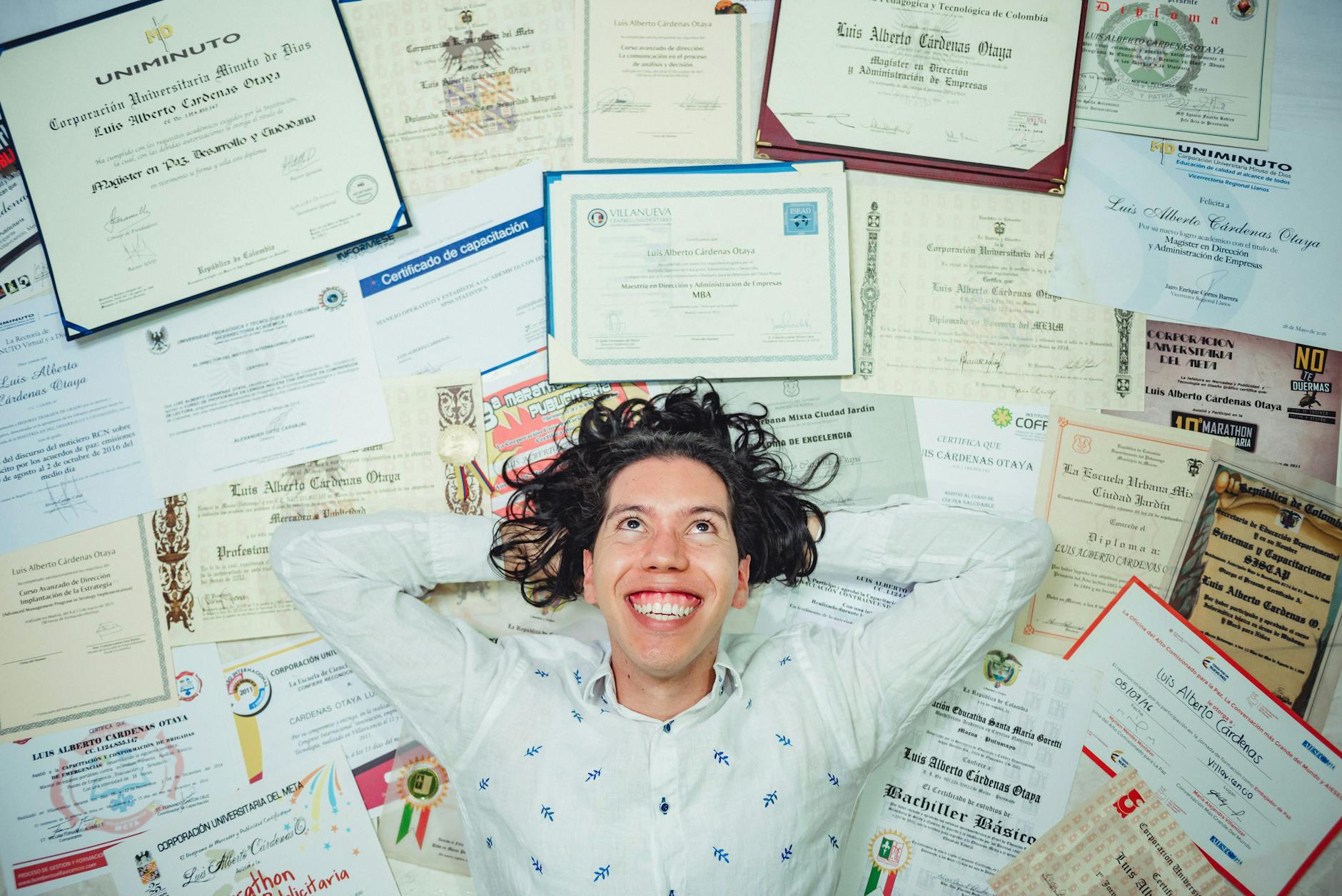 man lying on certificates